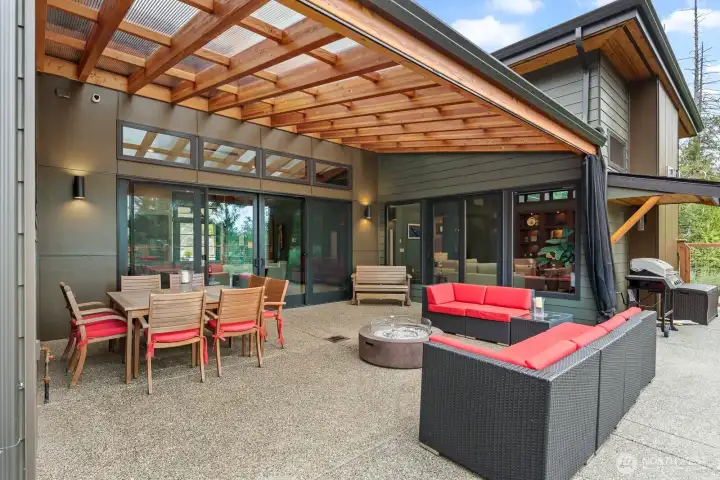 Covered and uncovered outdoor living space to enjoy.  Shade to pull if you want to enjoy in any kind of weather.  Gas firepit.  Plenty of space to create multiple sitting areas.