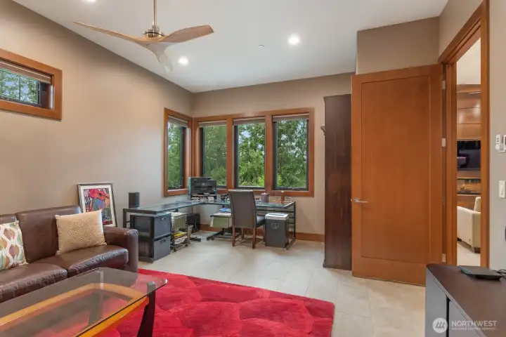 Den/office is off of living room.  Spacious enough for couch and your office area.