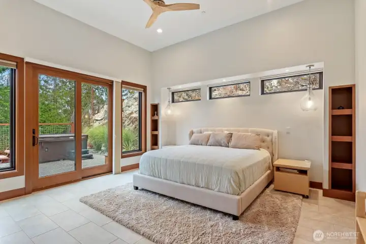 Primary suite with custom built ins, sliding door to hot tub and back patio area.  Second mini split in primary suite.