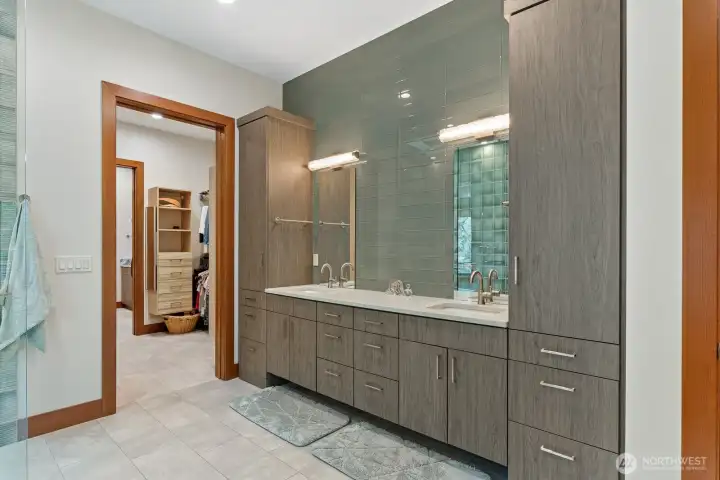 Tons of storage and dual sinks.  Door way leads to walk in closet then on to laundry room and back hallway.
