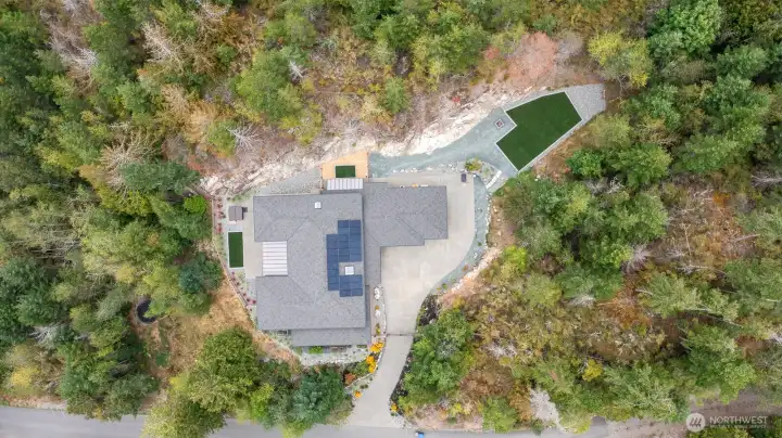 Large artificial turf play area.  There is a firepit area as well.  Home has private gate and there is a gate at entrance to neighborhood.