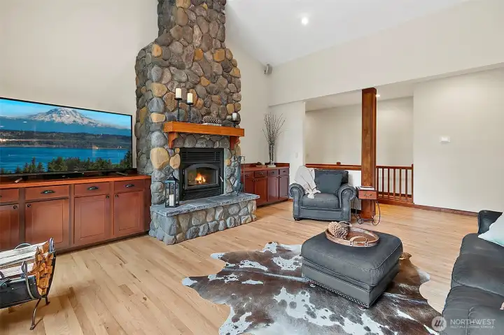 Living room with river rock fireplace and built-ins