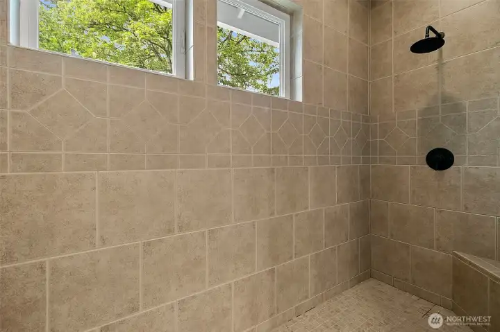 Primary walk-in shower with double shower heads