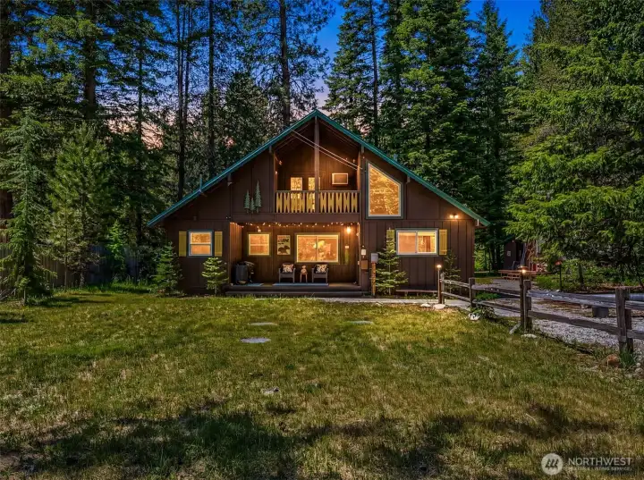 Classic mountain cabin tucked among mature evergreens with a covered front porch, upper balcony, and private, park-like setting. A welcoming retreat designed for enjoying the beauty of the surrounding forest. Classic mountain cabin tucked among mature evergreens with a covered front porch, upper balcony, and private, park-like setting. A welcoming retreat designed for enjoying the beauty of the surrounding forest.