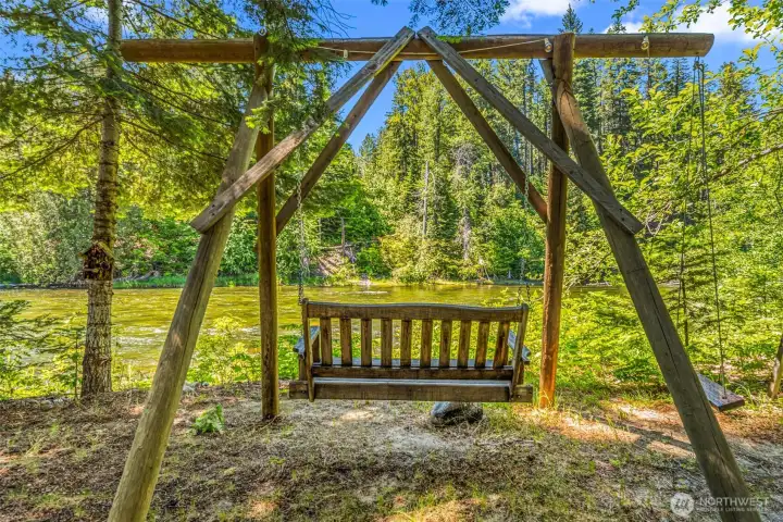 Private riverfront swing nestled among the trees, offering a peaceful place to relax and enjoy the beauty of the Wenatchee River. Private riverfront swing nestled among the trees, offering a peaceful place to relax and enjoy the beauty of the Wenatchee River.