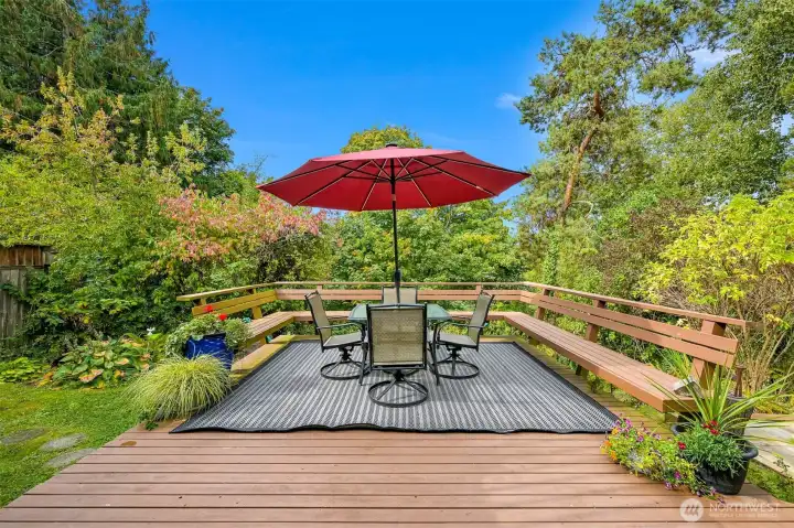 Built-in bench seating and generous gathering space provide an inviting setting for outdoor dining and enjoying the tranquil surroundings. Built-in bench seating and generous gathering space provide an inviting setting for outdoor dining and enjoying the tranquil surroundings.