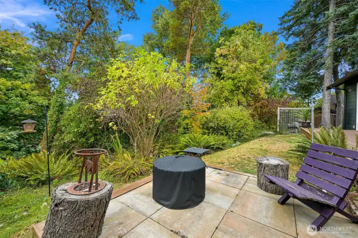 Fire Pit Patio – Cozy patio retreat nestled among mature landscaping, offering a quiet spot to gather around the fire and unwind. Fire Pit Patio – Cozy patio retreat nestled among mature landscaping, offering a quiet spot to gather around the fire and unwind.