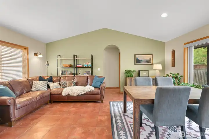 Open living and dining spaces are enhanced by vaulted ceilings and an airy layout designed for comfortable everyday living. Open living and dining spaces are enhanced by vaulted ceilings and an airy layout designed for comfortable everyday living.