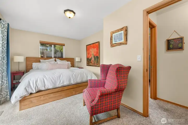 Primary Suite – Spacious primary suite offers a peaceful retreat with soft natural light, plush carpeting, and a comfortable sitting area. Primary Suite – Spacious primary suite offers a peaceful retreat with soft natural light, plush carpeting, and a comfortable sitting area.