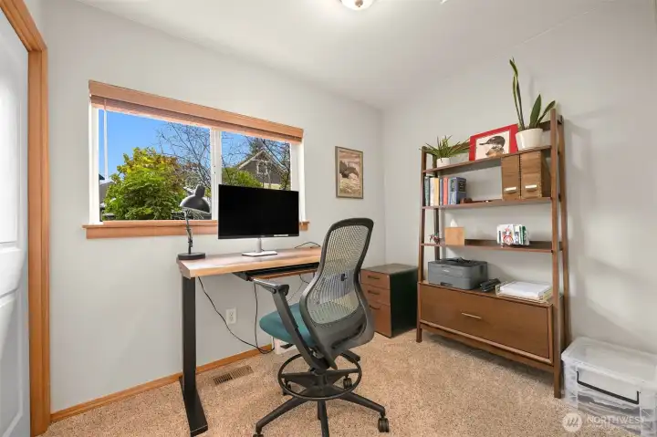 Bedroom #3/Home Office – Comfortable bedroom easily accommodates a home office setup, with large windows providing natural light and a pleasant outlook. Bedroom #3/Home Office – Comfortable bedroom easily accommodates a home office setup, with large windows providing natural light and a pleasant outlook.
