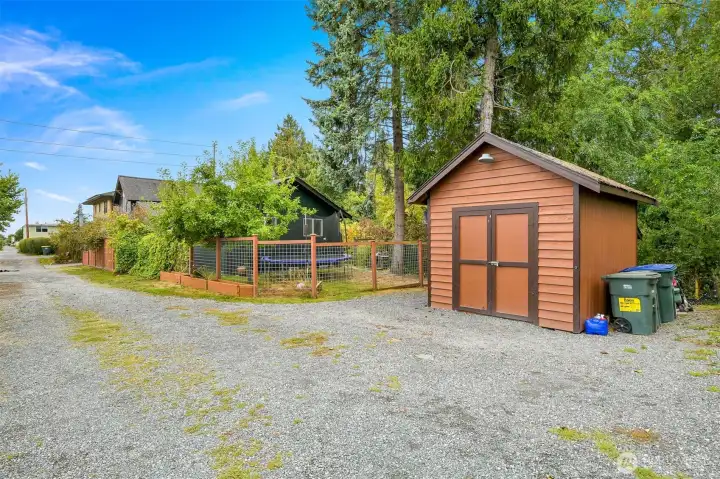 Detached Storage Shed & Alley Access – Detached storage shed and convenient alley access provide added functionality, with fenced outdoor space and mature landscaping enhancing privacy. Detached Storage Shed & Alley Access – Detached storage shed and convenient alley access provide added functionality, with fenced outdoor space and mature landscaping enhancing privacy.