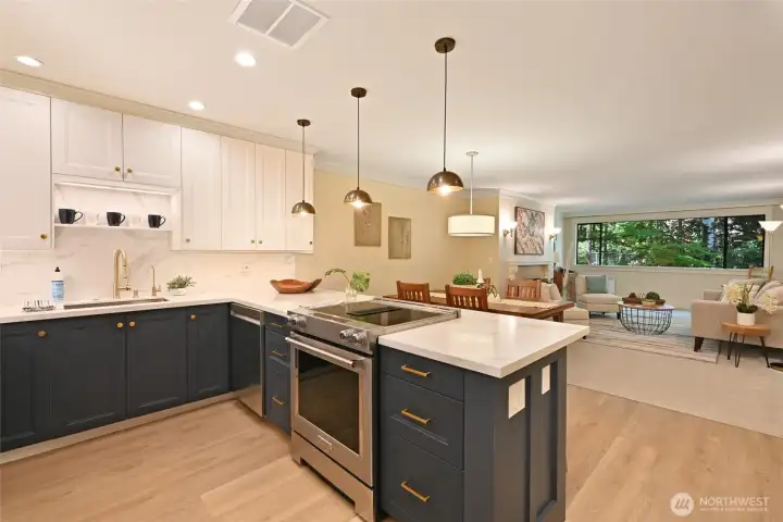 This fully remodeled chef's kitchen overlooks a spacious dining and living room. A modern floorplan was created.  New quartz counters, LED lighting and undercabinet lighting.