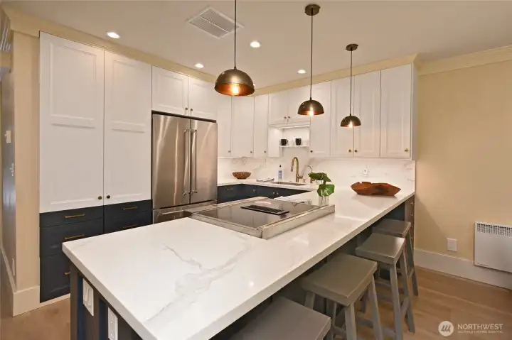 Quartz counters, LED lighting, and radiant heat in the lower right corner.