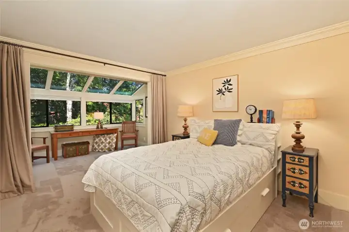 Master suite with solarium reading room. Notice the drapes can be drawn for privacy.