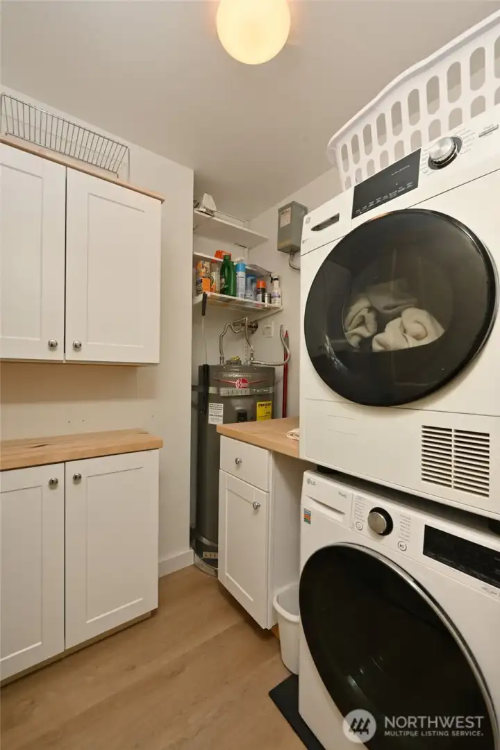 Laundry - Utility room.  New washer dryer, water heater and electrical panel (just out of view).
