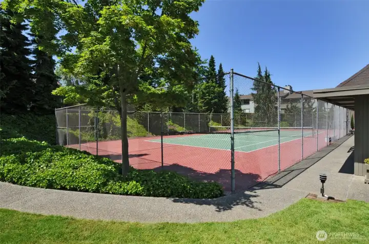 Community tennis court is adjacent to the clubhouse.