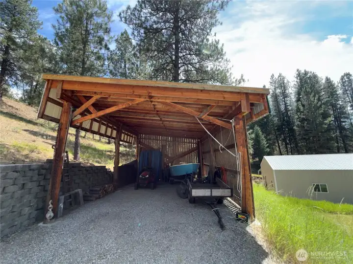 A separate covered carport provides even more space for boats, RVs, trailers or recreational equipment.