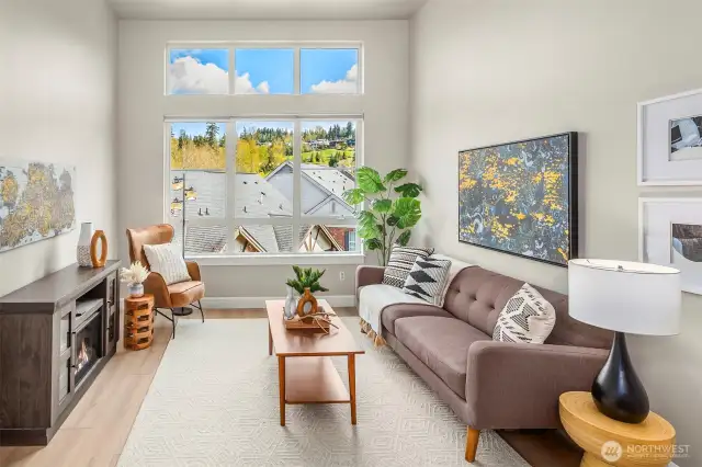 Open great room flooded with natural light and high ceilings