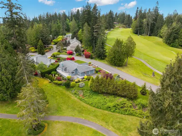 Very private setting nested between two Port Ludlow golf course fairways.