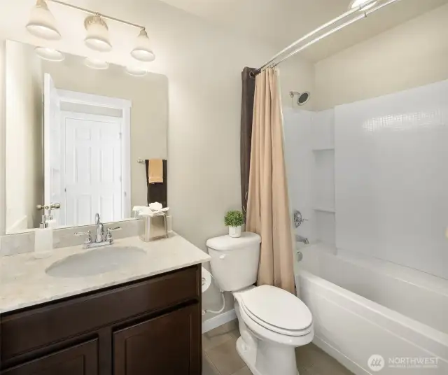 Tastefully designed full guest bathroom