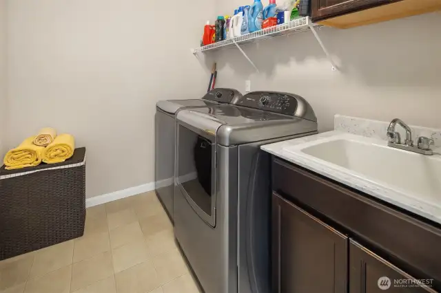 Convenient upstairs laundry with ample storage