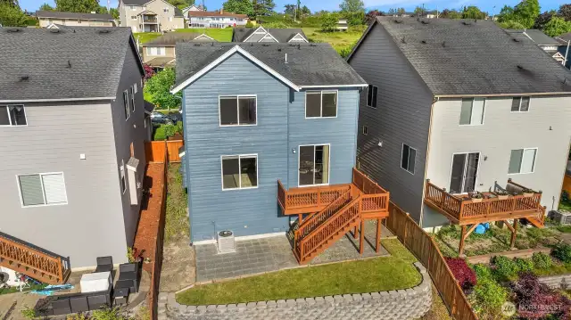 From above, see the inviting backyard—securely fenced and thoughtfully terraced for outdoor enjoyment.