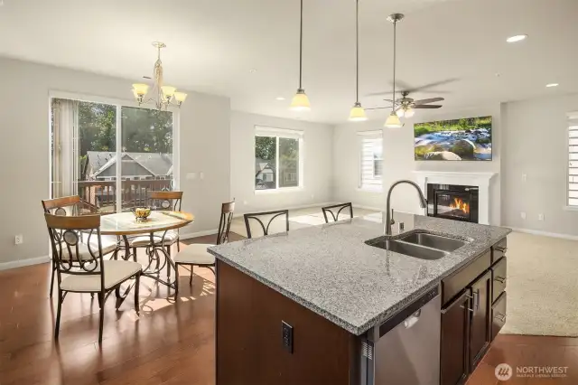 Open-concept layout connecting kitchen, living room, and dining space