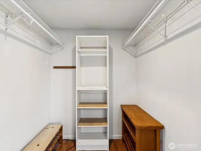 Expansive primary bedroom walk in closet provides ample storage