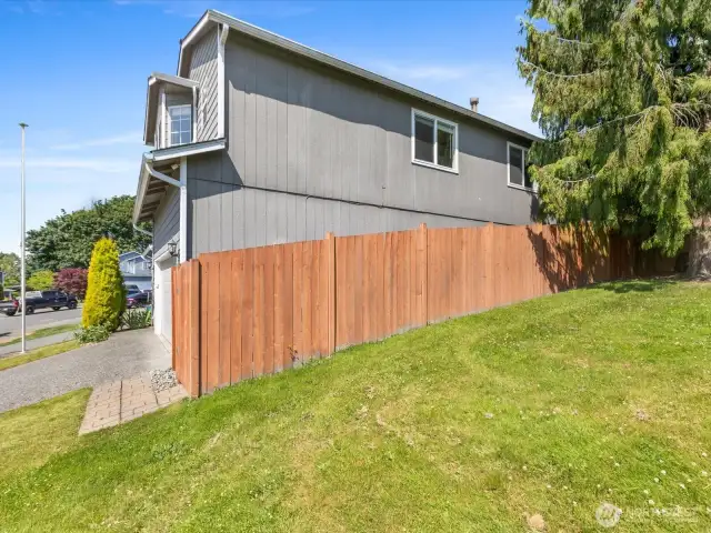 View of beginning of neighborhood playfield over property's fenceline
