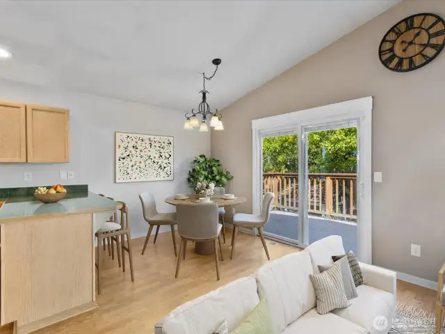 Dining area opens onto large deckspace for outdoor BBQs