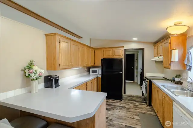 Sit up bar with tons of cabinet storage in the kitchen