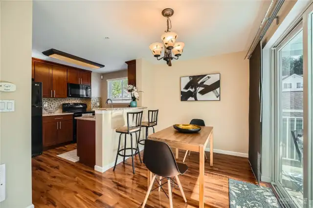 Formal dining/desk space opens to patio