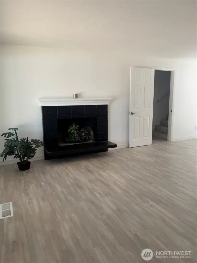 Living room with exit to garage and upstairs bedroom