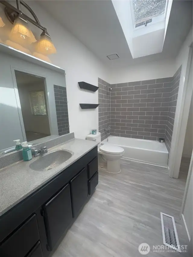 Main floor bathroom with new tile shower