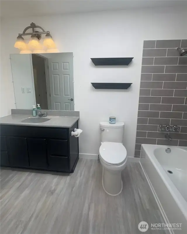 Main bathroom has second door to bedroom