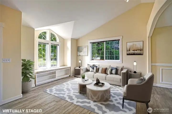 Living room with tons of light and built-in window seat.