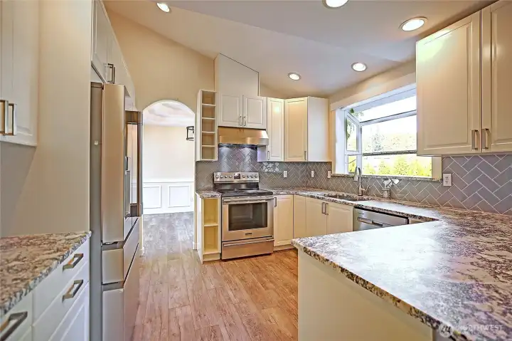 Completely updated kitchen with shaker cabinets, granite counters and stainless steal appliances!