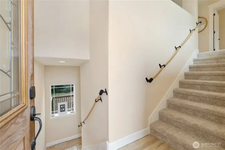 Light and bright entry with custom nautical themed handrails