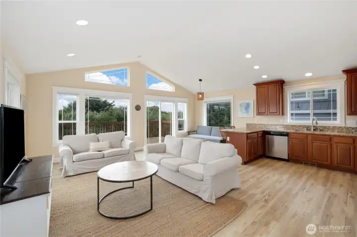 Vaulted ceilings and a wall of windows bring in natural light