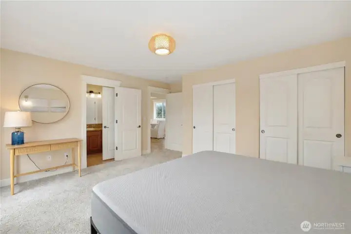 Primary bedroom with double closets and shared bathroom