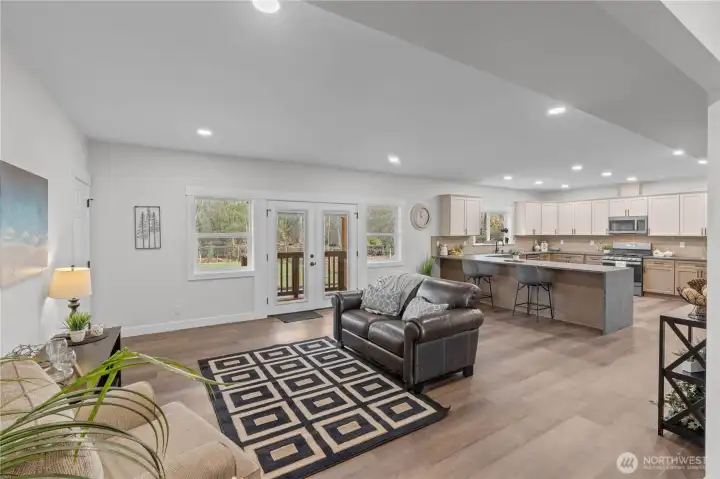 Great Room facing the Kitchen and Slider to the Backyard.
