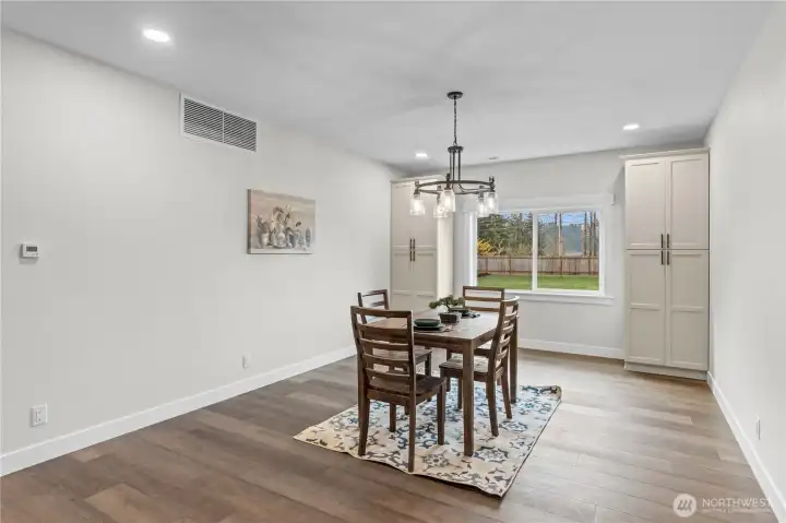Dining Room w/Built-Ins that perfectly frame the window overlooking the large front yard.