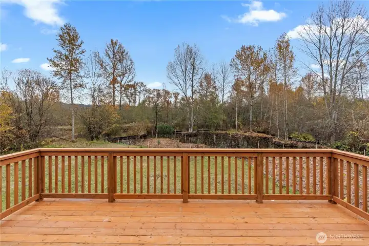 Entertainment size deck overlooking the backyard and wetlands area. Beyond the backyard is the Foothills trail and the Puyallup River.