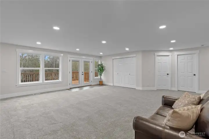 Upstairs you will be WOWed by the Enormous Loft-Style Family Room with plenty of recessed lighting. Head out onto the Deck and take in all the views!