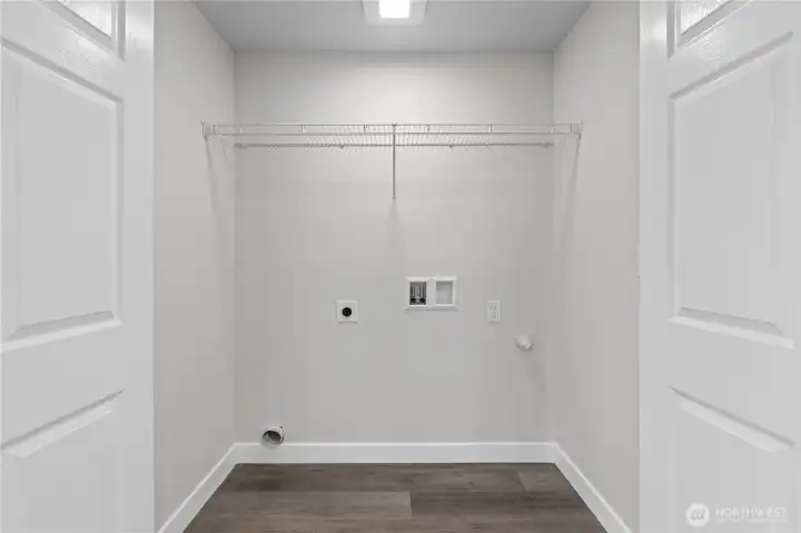 Laundry Closet off the Family Room makes keeping up with Laundry a BREEZE!