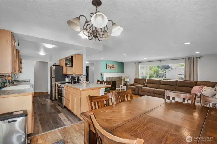 Dining area looking into kitchen and living room