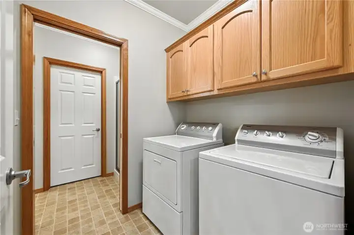 Laundry room with upper cabinet storage