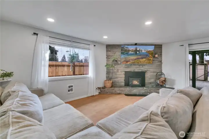 Living room with cozy wood stove, keeps it toasty through the winter
