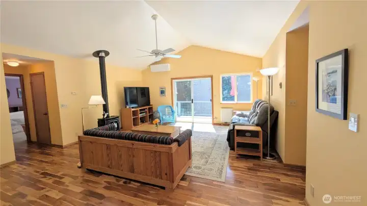 Primary suite to the left and two bedrooms and a bathroom to the right of the great room.