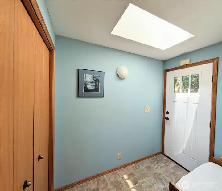 Welcoming entry with large closet and a huge sunny skylight.